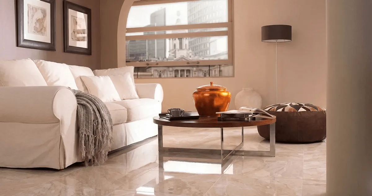 Modern living room with professionally installed marble flooring, a beige sofa, coffee table in Fort Lauderdale, FL