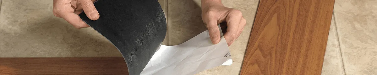 A professional installing vinyl flooring in Fort Lauderdale, FL